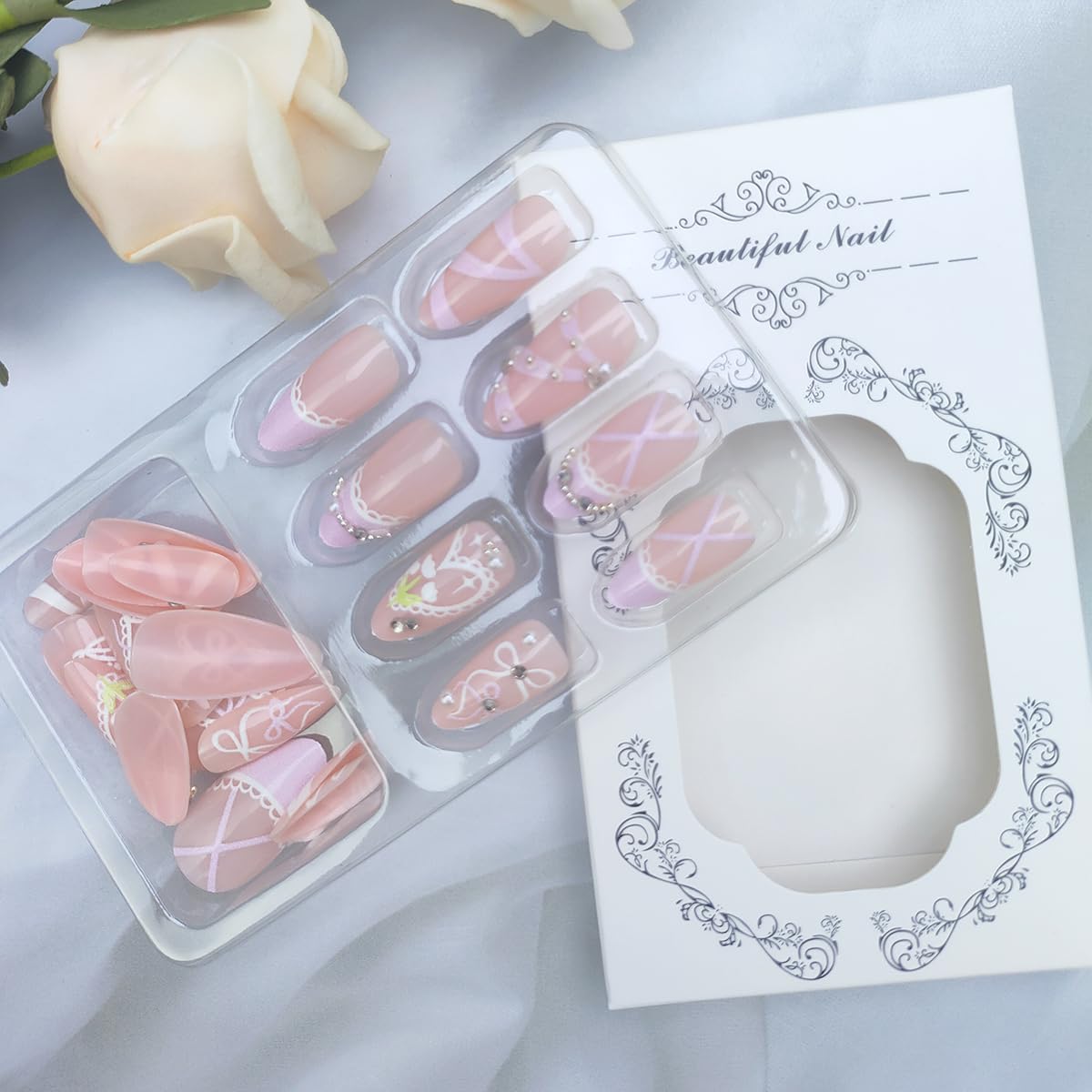 24Pcs Pink French Tip Press on Nails Medium Almond Fake Nails with Heart Pearl Bow Designs Nude False Nails Glossy Full Cover Acrylic Nails Cute Stick on Nails for Women Girls DIY Manicure Decorations
