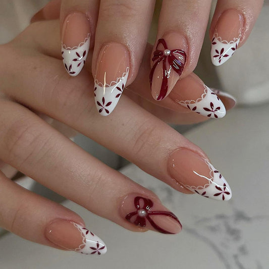 CJDLTS Flower Press on Nails Almond Shaped Artificial Acrylic French White False Nails 3D Floral Red Bow with Pearl Spring Glossy Design Medium Coffin Nail Artificial Fingernails for Women Manicure