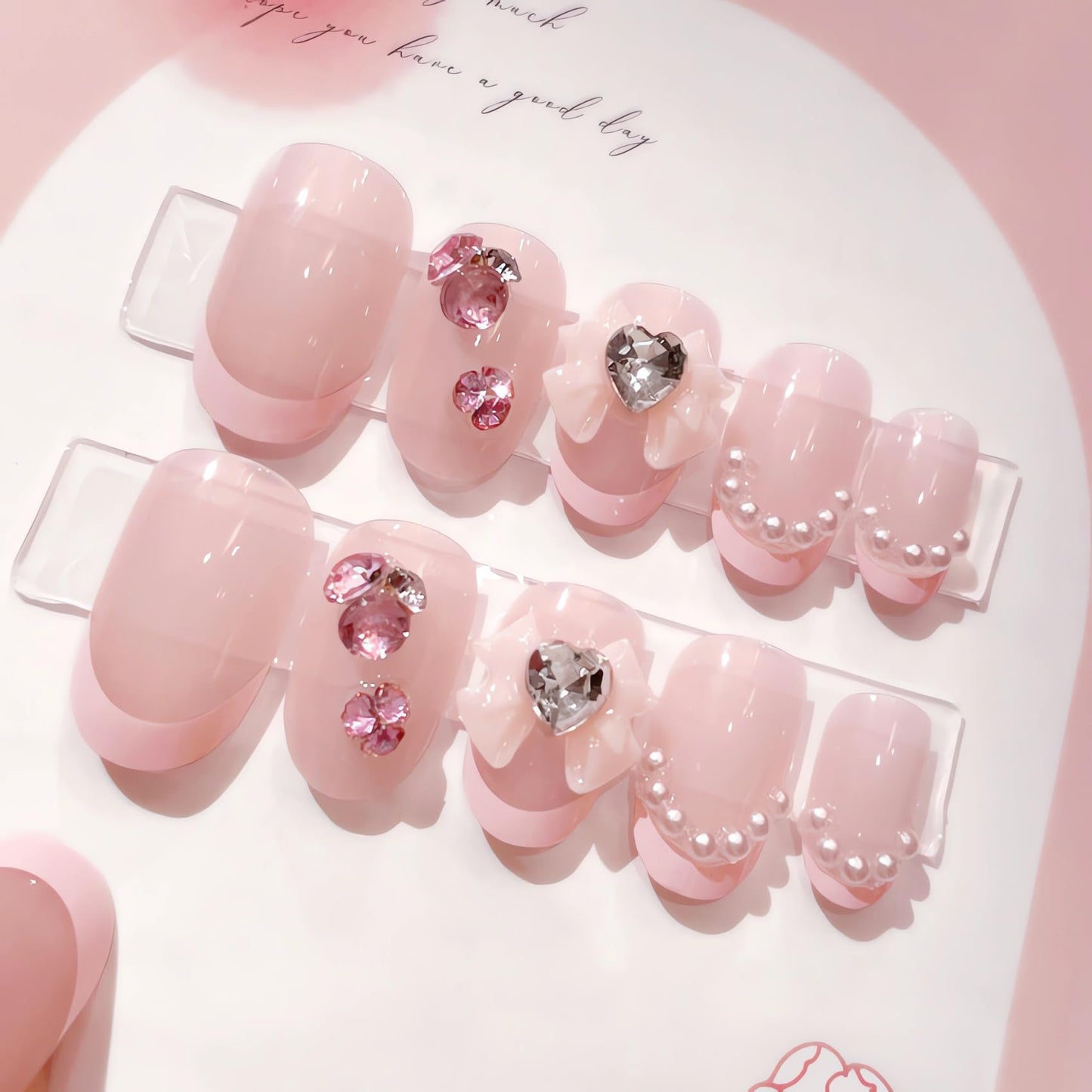 IMSOHOT Oval Press on Nails Pink Short Fake Nails French Tips Acrylic False Nails with Bow Tie Charms Designs Rhinestone Pearl Full Cover Glue on Nails for Women and Girls 24Pcs