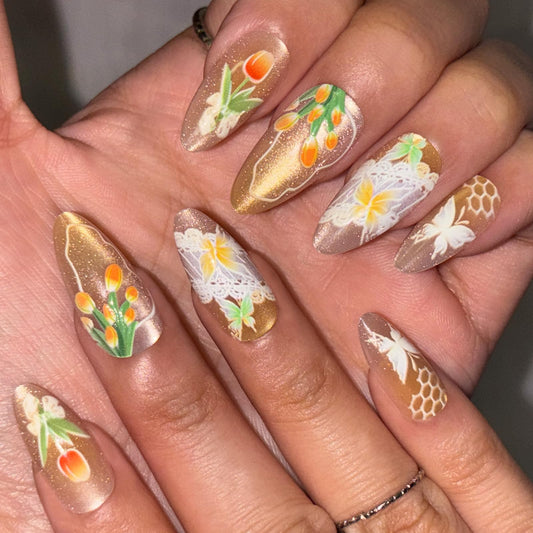 Spring Press on False Nails Gold Ombre Cat Eye Fake Nails Medium Almond Glue on Nails with Tulip Butterfly Designs Press ons Stick on Nail for Women Manicure 24Pcs
