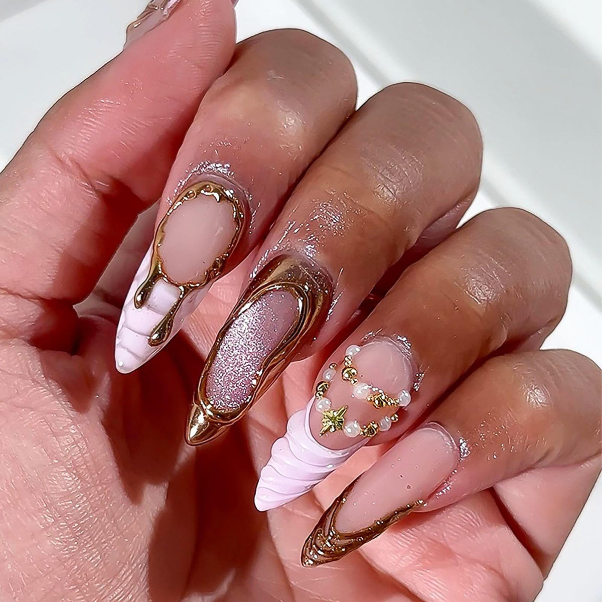 RUOKEXIN Long Stiletto Press on Nails French Tip Fake Nails Pink False Nails with Gold 3D Designs VAlmond Nail Press ons Sparkly Artificial Nails for Women 24Pcs