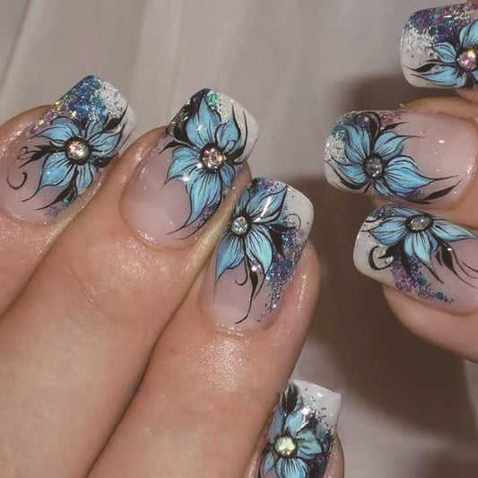 TBRZTR Blue Flower Press on Nails Short Square Artificial Coffin Nails Press Nails with Charm Acrylic Nails Nude False Nails Full Cover Glue on Nails Reusable Stick on Nails for Women 24Pcs