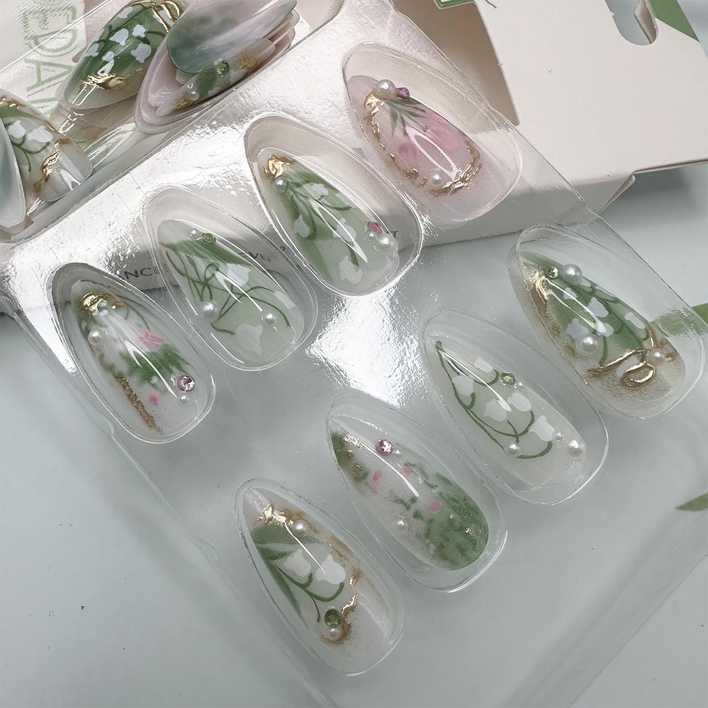 LBPEPAMZ Green Press on Nails Medium Almond Fake Nails with 3D Pearl Rhinestones Designs Gold French Tips Flower Acrylic Nails False Nails White Floral Full Cover Glossy Stick on Nails for Women 24Pcs