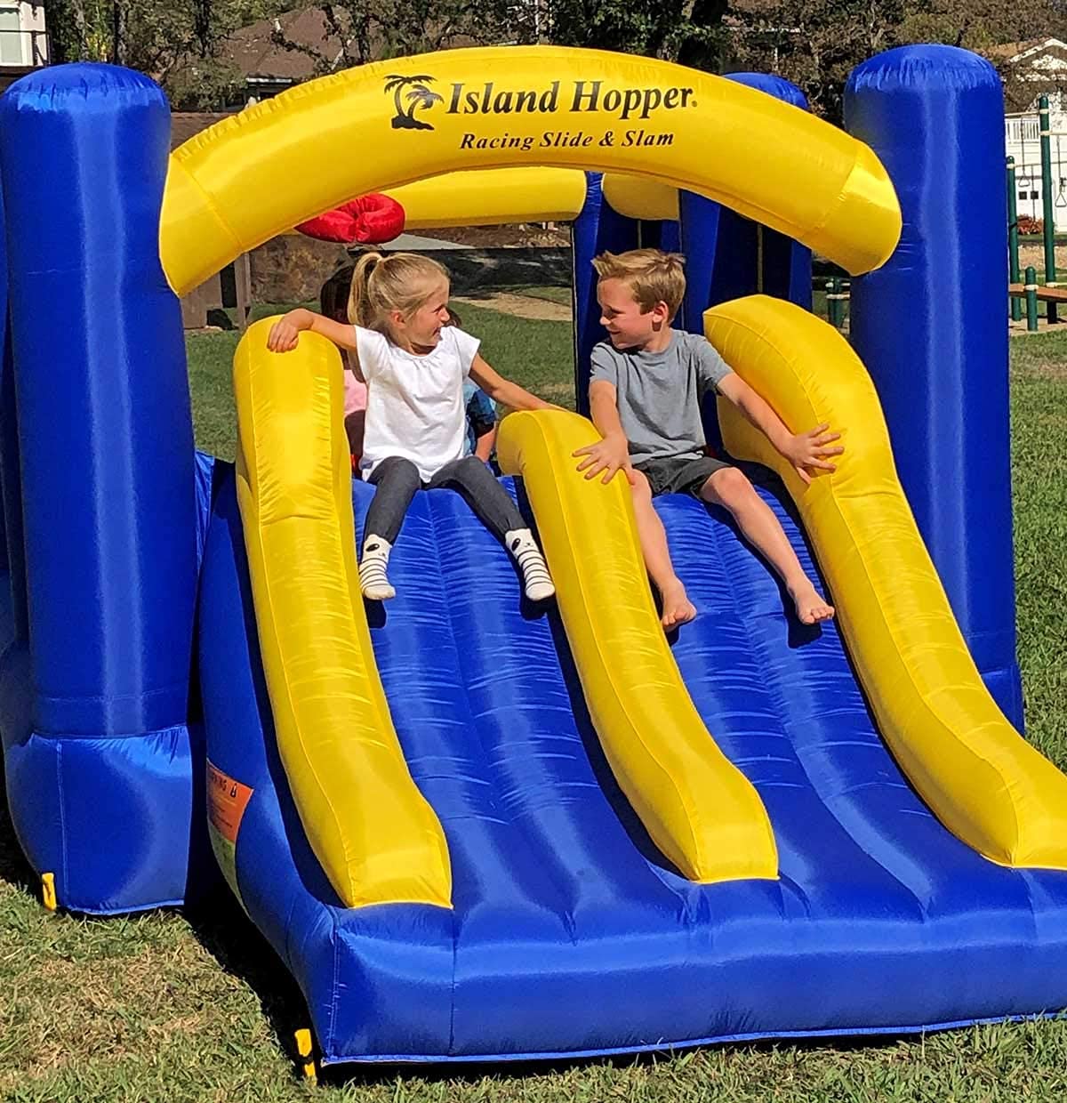 Island Hopper Racing Slide and Slam Inflatable Bounce House – Dual Slides, Climbing Wall & Basketball Hoop for Fun – Jumper for Kids with Durable PVC Build – Outdoor/Indoor Bounce House for Big Kids