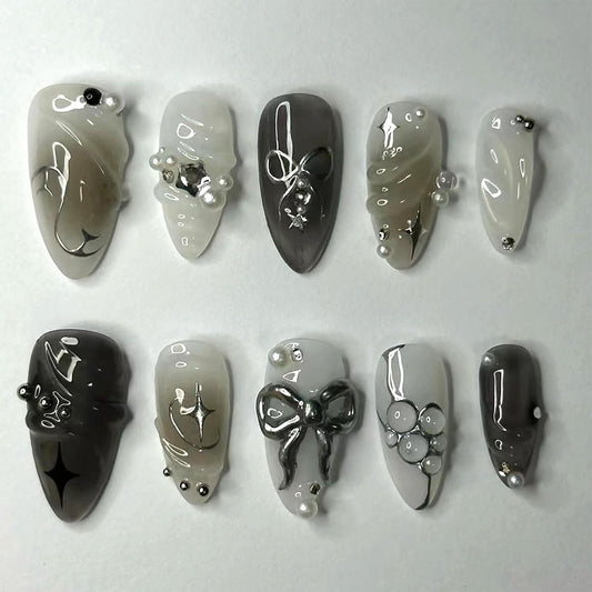 24Pcs Black Bow Press on Nails Medium Almond Fake Nails with 3D Alloy Bow Pearl Designs White Glitter False Nails Full Cover Artificial Glue on Nails Spring Summer Handmade Stick on Nails for Women
