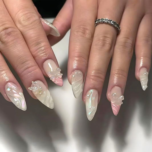 Medium Press on Nails Almond Fake Nails Pink False Nails French Artificial Nails Nude Cute Nails with 3D Bow and Pearl Designs Sparkly Stick on Nails for Women 24pcs