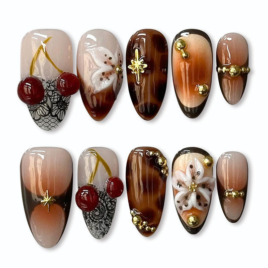 Almond Press on Nails Medium Fake Nails with Flowers Cherry Pearl Irregular Pattern Designs Brown Gradient Nails Press ons Glossy Full Cover Reusable Stick on Nails for Women 24Pcs