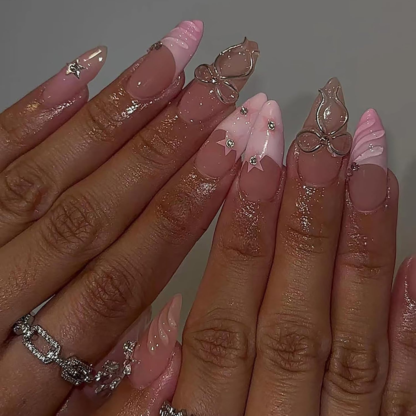 RIICFDD 24 Pcs Medium Almond Press on Nails Pink Fake Nails Star Nails Press ons 3D Water Ripple Glue on Nails Bow Rhinestone Nail Charms Full Cover Glossy Acrylic Nails for Women French Nails