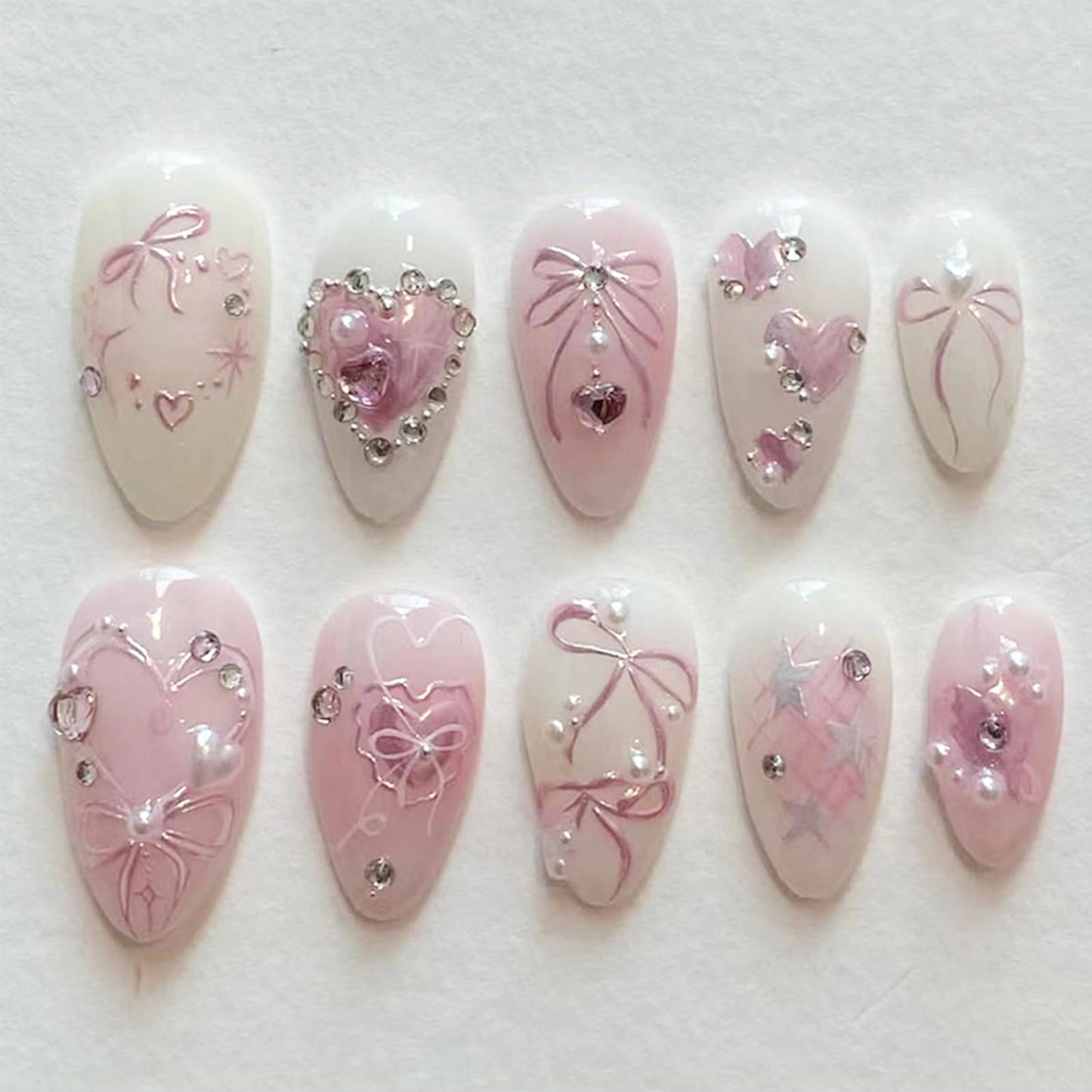 LBPEPAMZ Pink Press on Nails Medium Almond Fake Nails with 3D Heart Pearl Rhinestones Designs White Gradient Bow Silver Star Stick on Nails Flower Charms Full Cover Glue on Nails for Women Girls 24Pcs