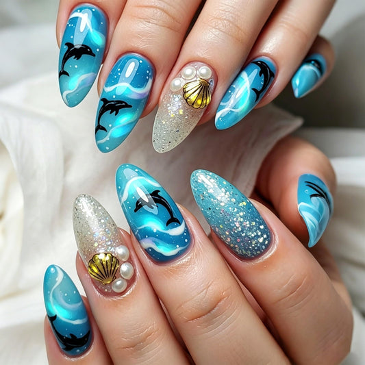 24Pcs Ocean Theme Press on Nails Medium Almond Fake Nails Ocean Blue Gradient with Dolphin & Wave Design Silver Glitter 3D Gold Shell & Pearl False Nails Acrylic Full Cover Stick on Nails for Women