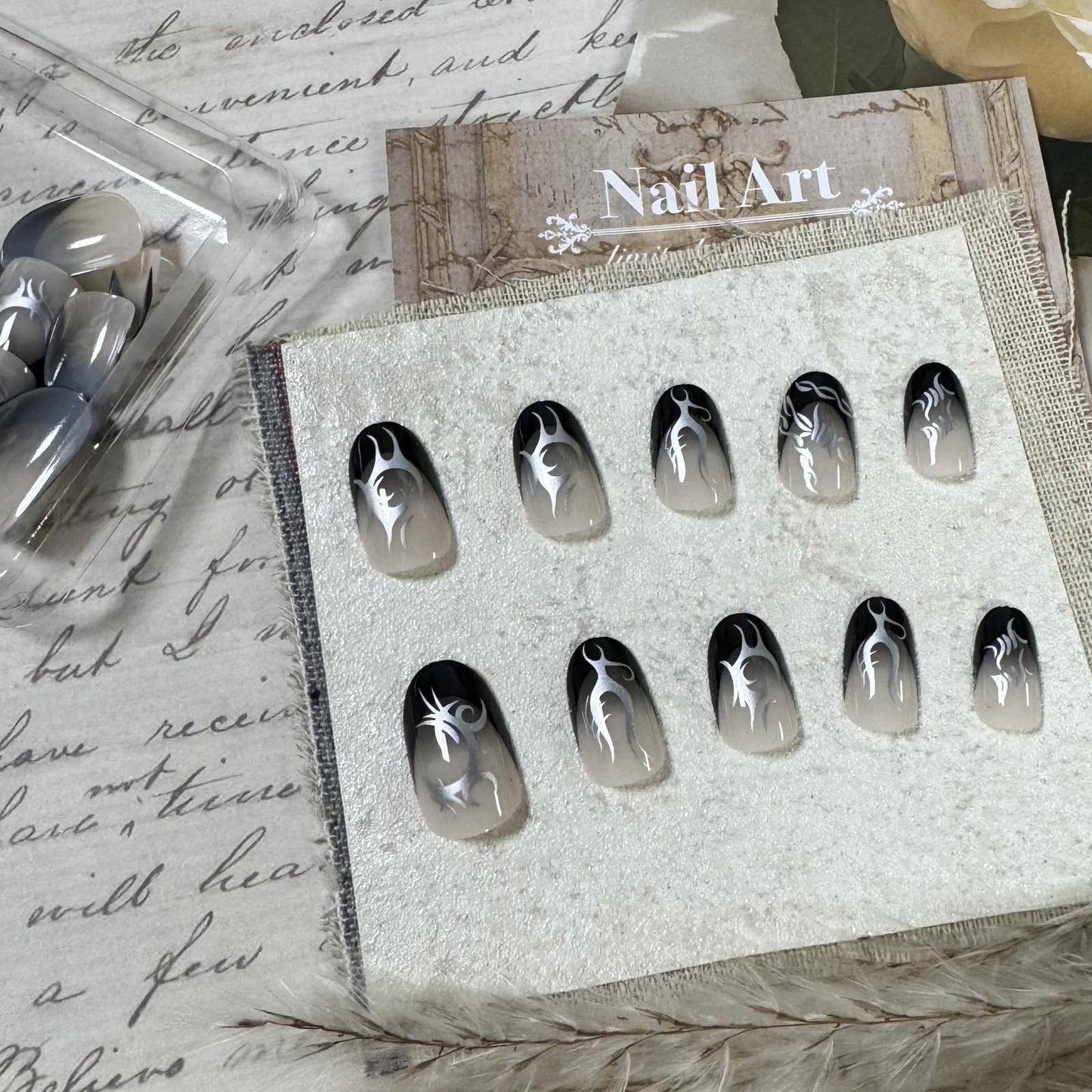 IMSOHOT Short Press on Nails Oval Black French Tips Fake Nails with Silver Totem Designs Round Full Cover Glossy Acrylic Gothic Glue on False Nails for Women 24Pcs