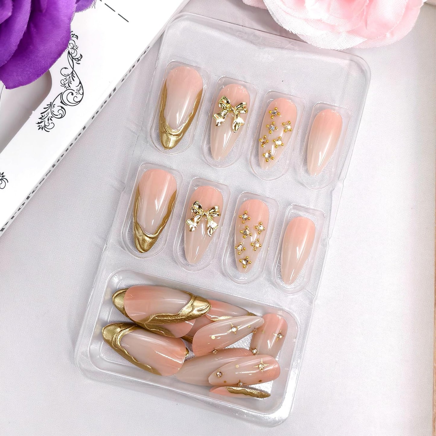 24Pcs Nude Pink Press on Nails Almond Shaped Artificial Acrylic French Metal Irregular Lines Design 3D Metallic Bow with Stars Fake Nails Medium Glossy Stick on Nail Artificial Fingernails for Women